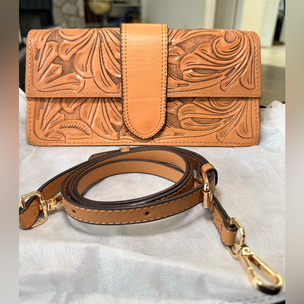 Hand tooled leather clutch crossbody bag
Alejandro Yeo